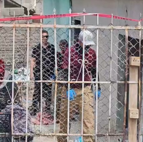 Hallan muerto enterrado en predio